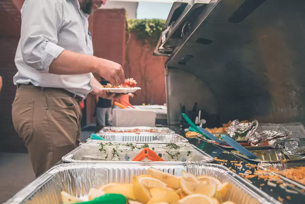 a table of catered food at a corporate event